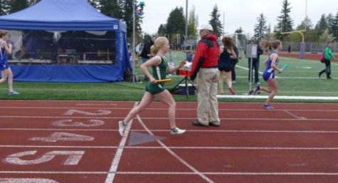 Gamble running the 4x800 meter relay at the Lake Washington Girls Invitational where she placed second, and set the school record.