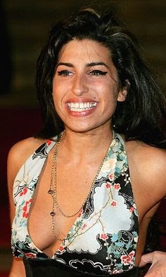 LONDON - FEBRUARY 9:  Jazz singer Amy Winehouse arrives at the 25th Anniversary BRIT Awards 2005 at Earls Court February 9, 2005 in London.  (Photo by MJ Kim/Getty Images)